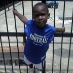 waiting for Darius and Josh to get off the ride so he can ride